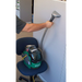 Woman cleaning a wall with Bissell BGU1451T bagged upright vacuum.