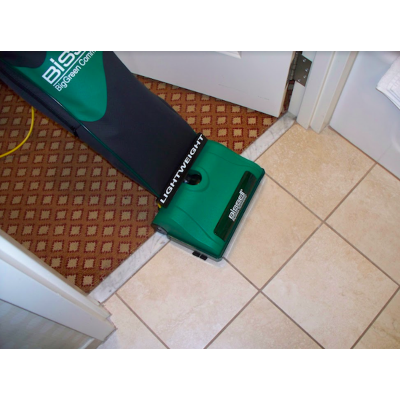  Bissell BGU8000 Upright Vacuum cleaning the floor at an angled view.