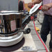  Worker polishing floor with General Floorcraft Mini Top 12" Floor Machine