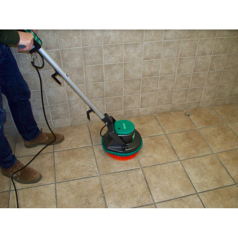  Operator using the Johnny Vac to clean the floor.