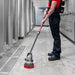 Motor Scrubber M3 Backpack Floor Scrubber in use by worker cleaning a hallway efficiently